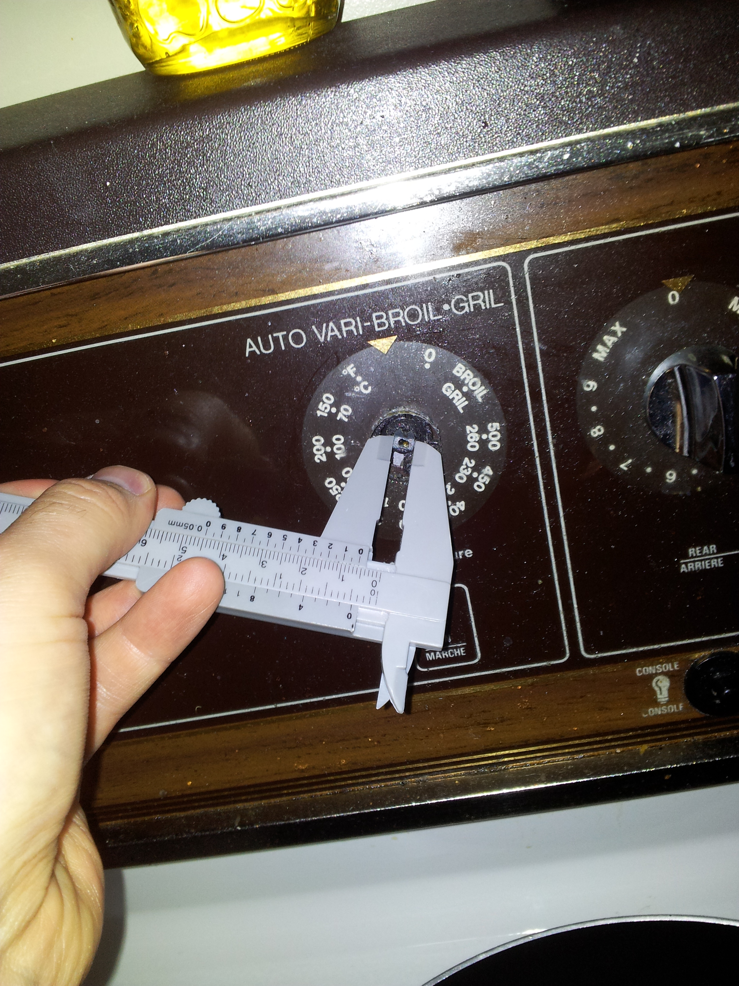 Taking measurements for oven knob
