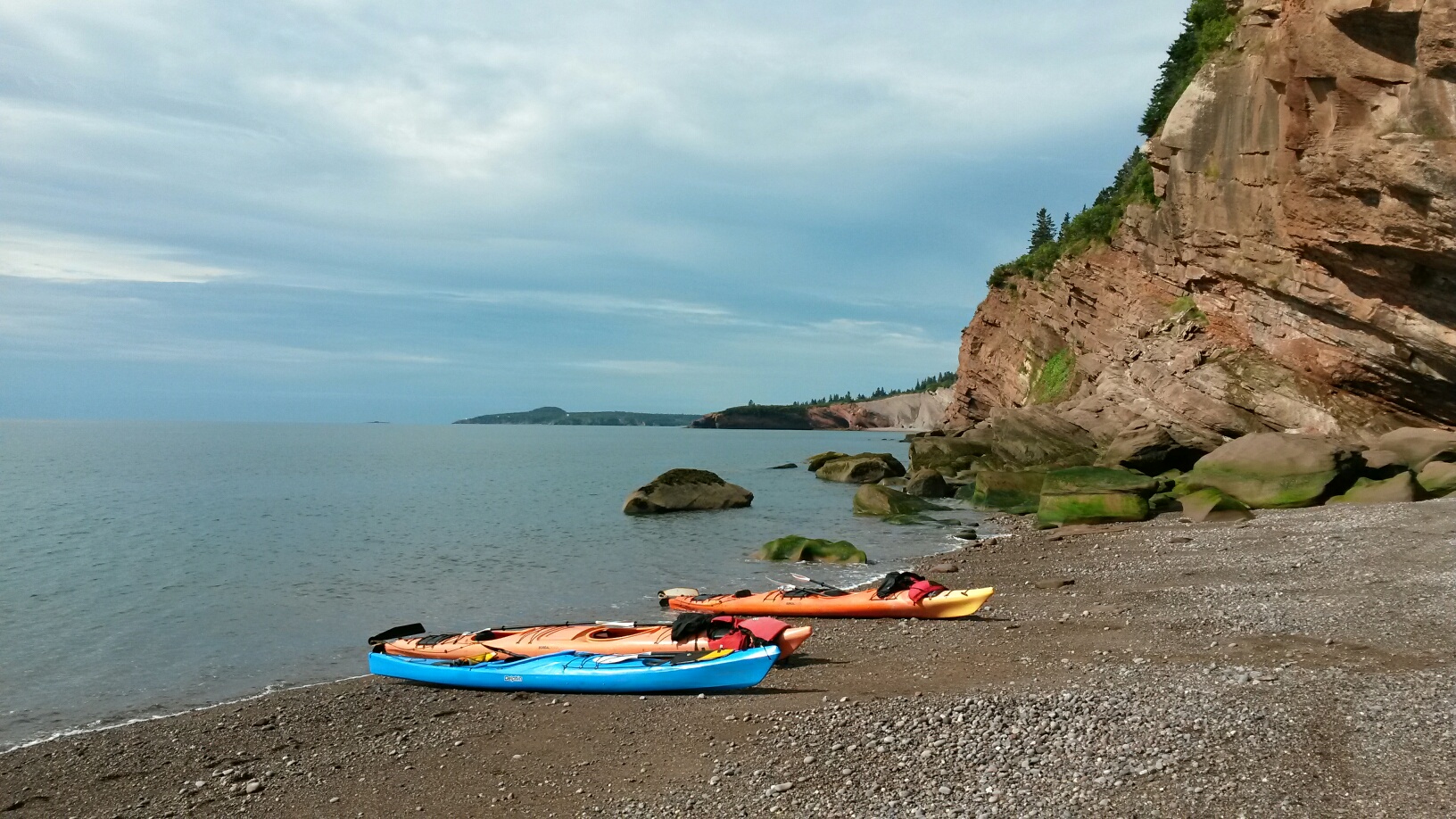 Sandstone cliffs and sea kayaks